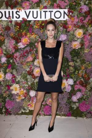 Dylan Penn looks stunning in a little black dress adorned with sequins at the Louis Vuitton dinner during the 74th Cannes International Film Festival on 13th July 2021. 
