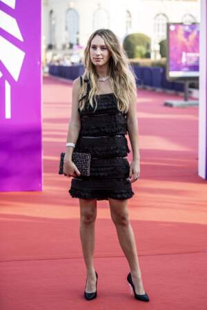 Dylan Penn, in a little black Chanel dress, looks radiant on the red carpet at the opening ceremony of the Deauville Film Festival on 3rd September 2021. 