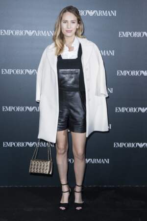 Dylan Penn looking ravishing in a little black leather dungaree-style dress paired with an elegant white straight coat to attend the presentation of the Armani ready-to-wear collection in Paris on 3rd October 2016.