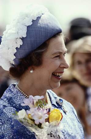February 1979: A blue hat adorned with faux cherry blossoms