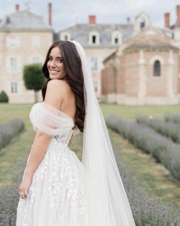 She wore a bustier wedding dress with a thigh-split