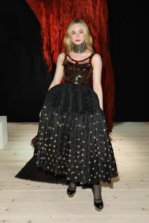 Elle Fanning: A daring black dress that featured a leopard print